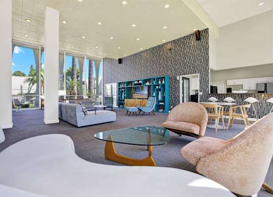 Clubhouse lounge with dining area and textured accent wall at Parc @ 5 Apartments, California, 90240