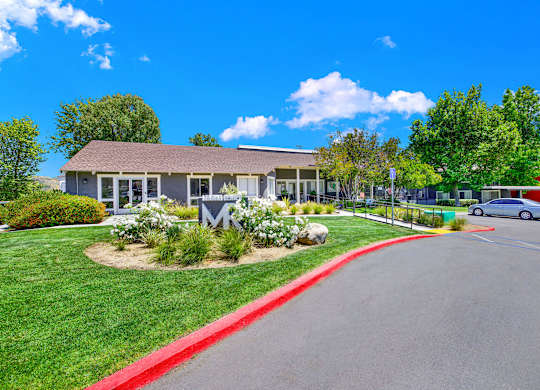 the front of a building with a car parked in front of it at Monterra Ridge Apartments, Canyon Country