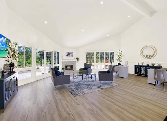 a living room with furniture and a fireplace at Monterra Ridge Apartments, Canyon Country, California