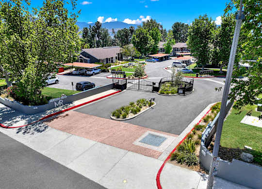 a view of a park with a playground and a parking lot at Monterra Ridge Apartments, California,91351