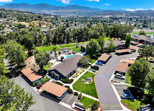 an aerial view of a neighborhood with houses and cars on the street at Monterra Ridge Apartments, Canyon Country