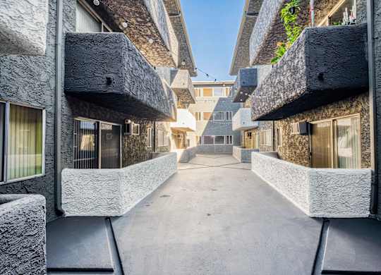 view of corridor between buildings
