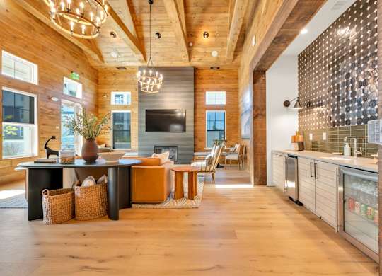 A modern kitchen with wooden floors and a large island.