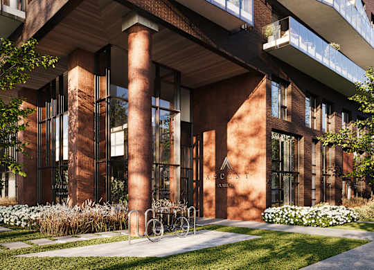 A modern building with a bicycle parked in front.