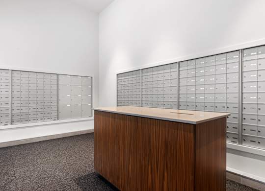 A room with a wooden desk and filing cabinets.