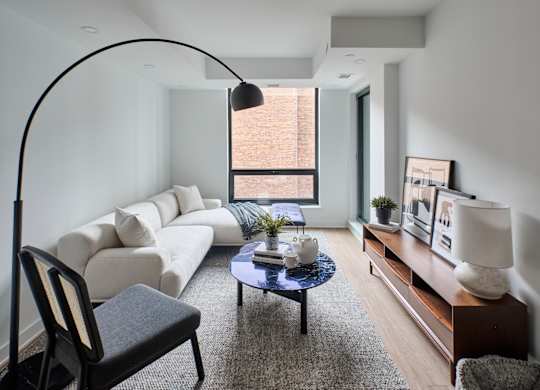 a living room with a white couch and a coffee table