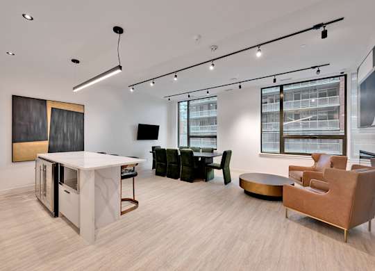A modern living room with a white sofa and a wooden coffee table.