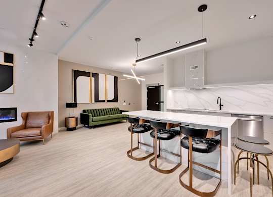 A modern kitchen with a bar area and seating.