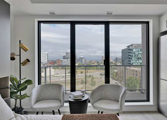 A modern living room with a view of the city.