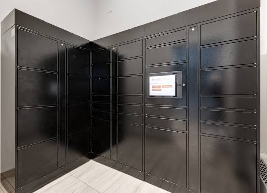 A black metal locker room with a white door.