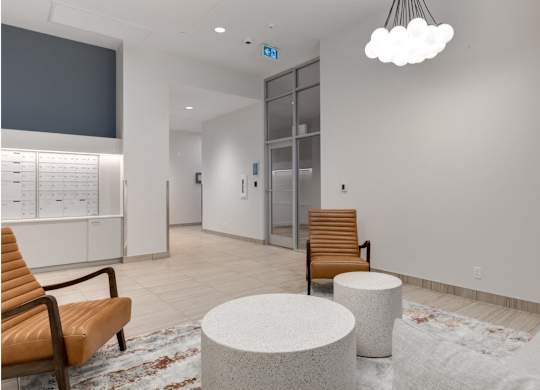 A waiting area with a chair, a table, and a TV.
