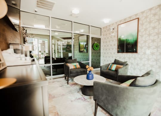 a living room with couches and a table at Canalside, Augusta, GA