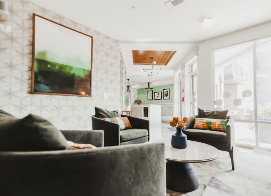 a living room with couches and chairs and a table at Canalside, Augusta, GA