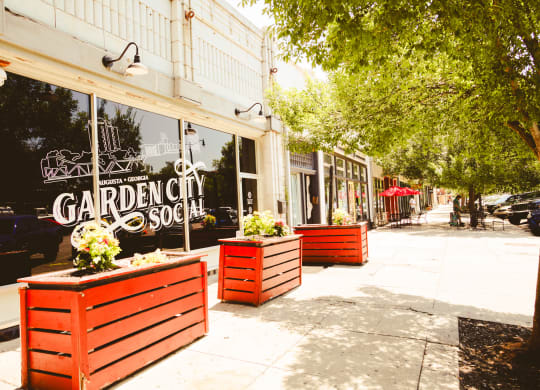 the sidewalk in front of a store called garden city soap at Canalside, Augusta, GA