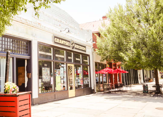a street view of a coffee shop on a city street at Canalside, Augusta, GA
