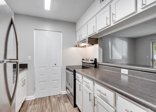 Galley Kitchen With White Cabinetry & Brushed Nickel Hardware
