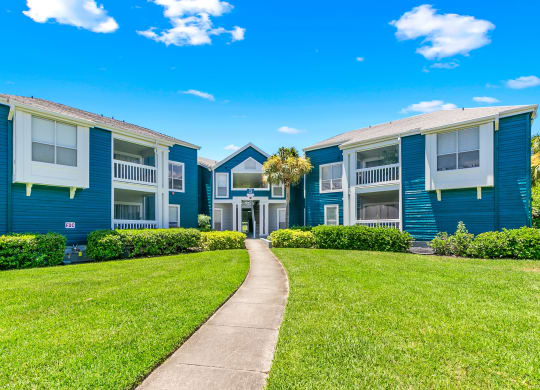 Lush Greenery & Grounds In Front Of Apartment Homes