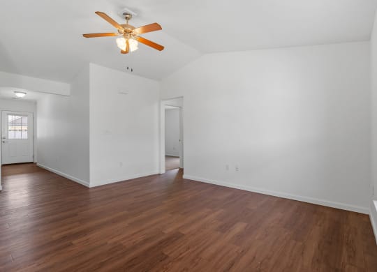 Spacious Living Area With Wood-Style Flooring