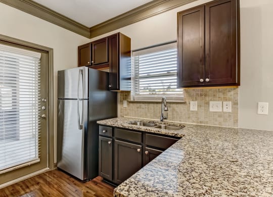 Fully-Equipped Kitchen with Granite Countertops
