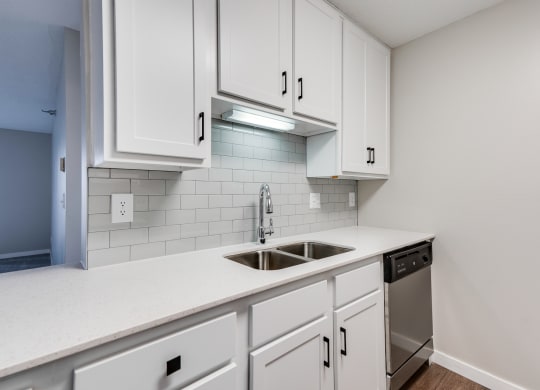 Kitchen with White Cabinetry and Subway Tile Backsplash