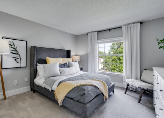 Carpeted Bedroom With Large Windows