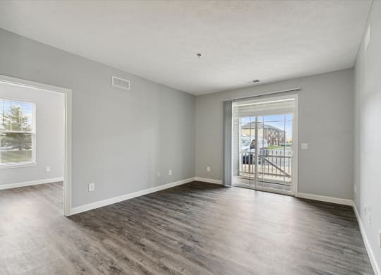 Spacious Living Area With Wood-Style Flooring