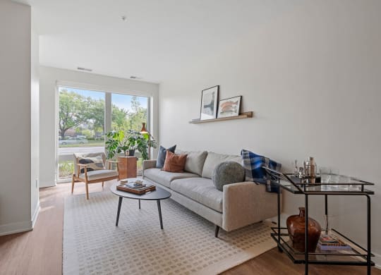 Living Room With Lots Of Natural Light & Wood-Style Floors