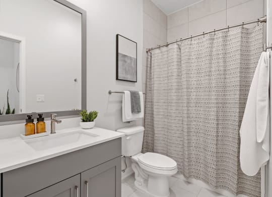 Bathroom Featuring Tiled Floor & Shower