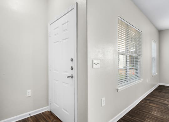 Front Door Entrance With Large Windows In The Living Area - Elms Floor Plan