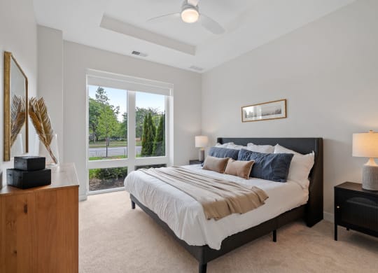 Bedroom Featuring Floor-To-Ceiling Windows With Window Coverings