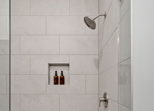 Tiled Shower Featuring Glass Door