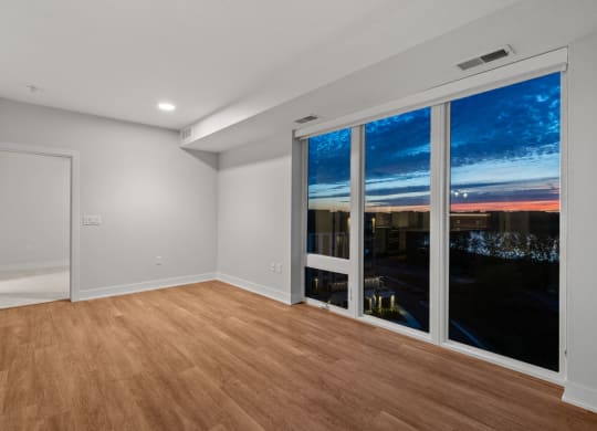Spacious Living Area With Wood-Style Flooring