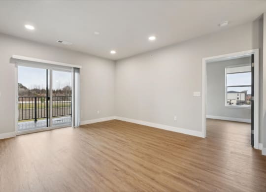 Spacious Living Area With Wood-Style Flooring