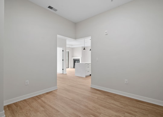 Den Area with Wood-Style Flooring