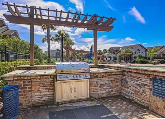 Outdoor Kitchen Area With Pergola