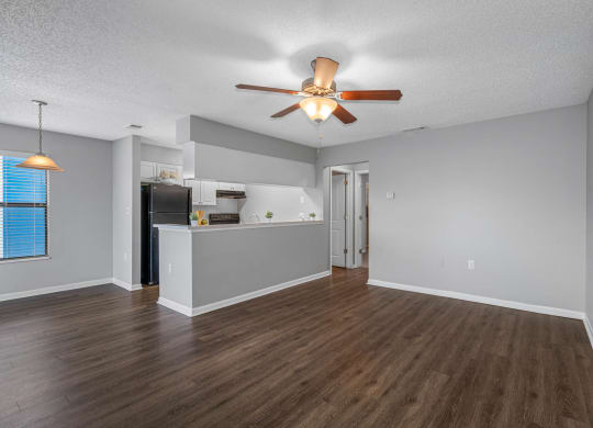 Spacious Living Area With Wood-Style Flooring