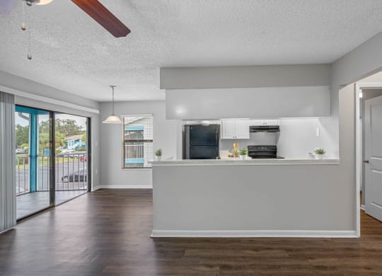 Spacious Living Area With Wood-Style Flooring