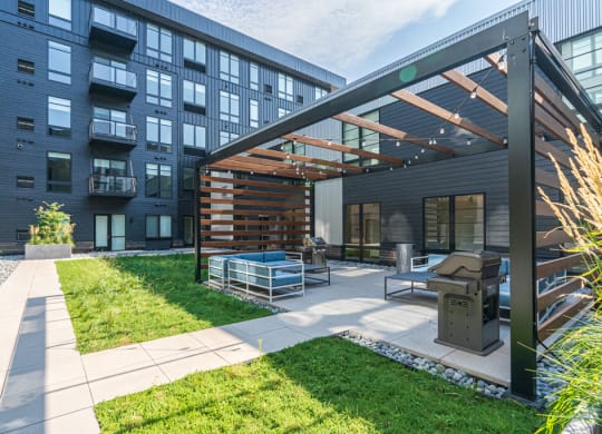 Courtyard Pergola with Grill and Seating
