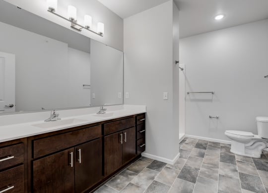 Spacious Bathroom Featuring A Dual Vanity