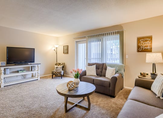 a living room with a couch and a tv