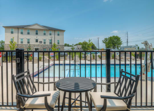 Patio seating next to pool