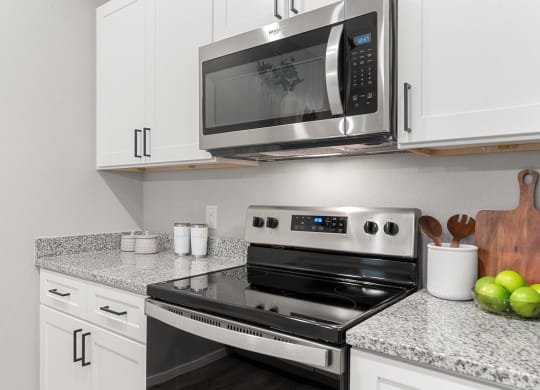 Kitchen with White Cabinetry and Stainless Steel Appliances