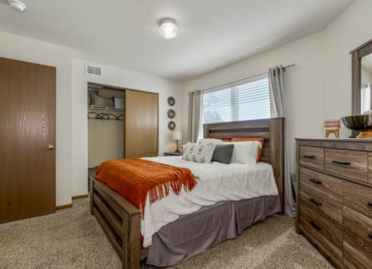 Cartpeted Bedroom With Large Windows