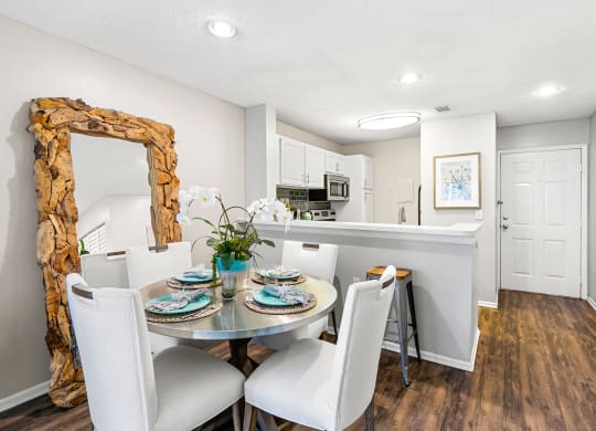 Open Concept Kitchen & Dining Room Area With Wood-Style Flooring