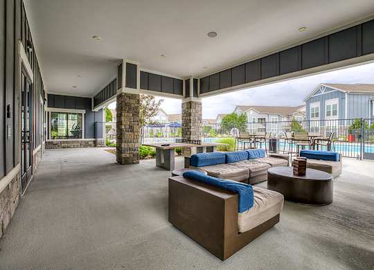 Poolside lounge with couches & recreation table