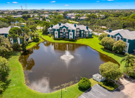 Aerial View Of Apartment Homes Overlooking The Pond & Fountain