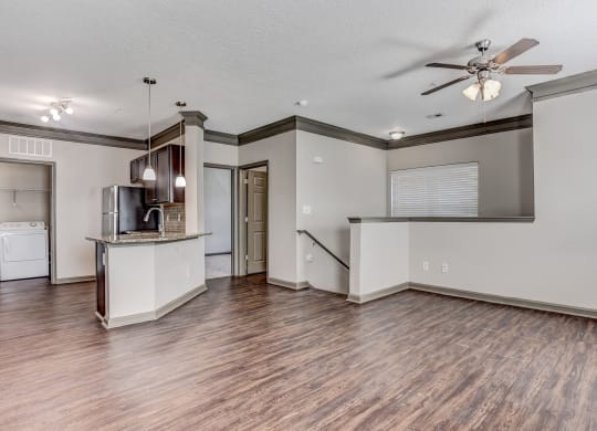 Stairwell Leading Up To The Living Area With Wood-Style Floors