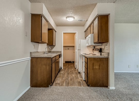 Kitchen with Wood Cabinetry and Granite Countertops