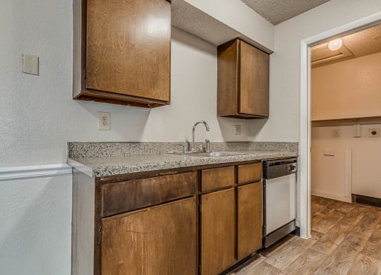 Kitchen with Wood Cabinetry and Granite Countertops