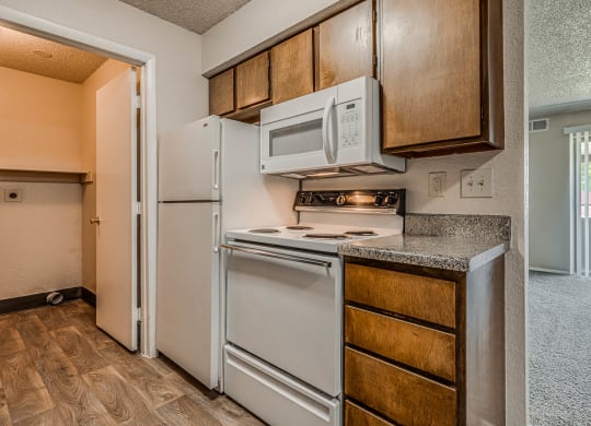 Kitchen with Wood Cabinetry and Granite Countertops